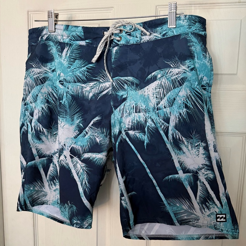 Billabong Blue and White Board Shorts with Tropical Design